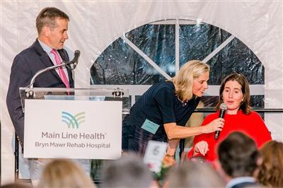 Bryn Mawr Rehab patient and honored guest, Lee Lee Jones (right) with her parents Richie Jones (left) and Evie Jones (center)