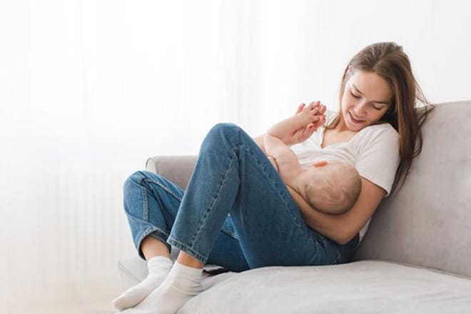 woman breastfeeding baby