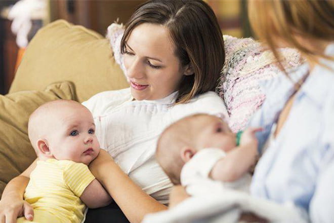 two breastfeeding mothers