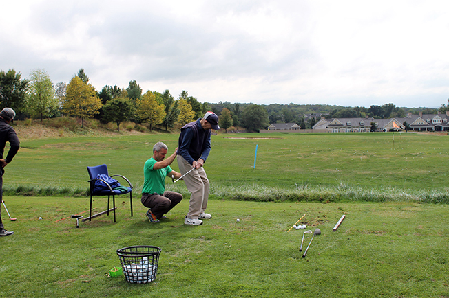 First Swing 2016 attendee golfing with assistance