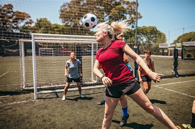 Ball hitting soccer player on head Ball hitting soccer player on head
