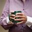 Older hands holding a mug