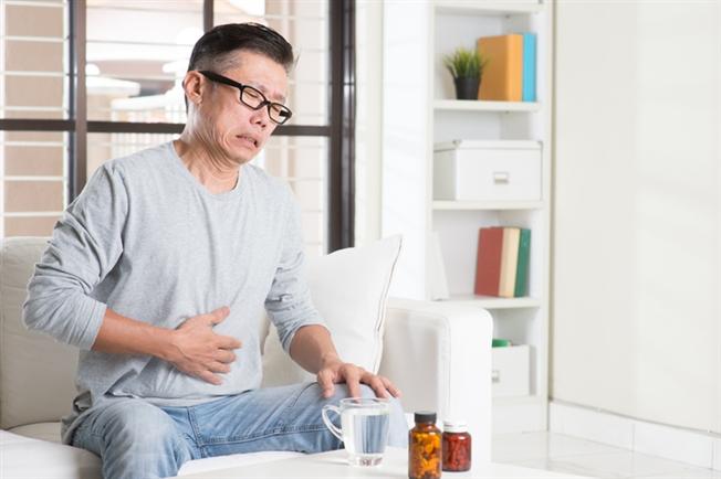 Man having stomach pain Man having stomach pain
