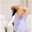 Woman in background with hands over her head ready for an exam