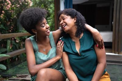 Mother and daughter smiling at each other