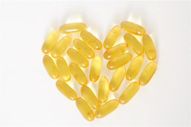 Oil capsule vitamins arranged in a heart shape