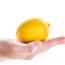 A hand holding a lemon