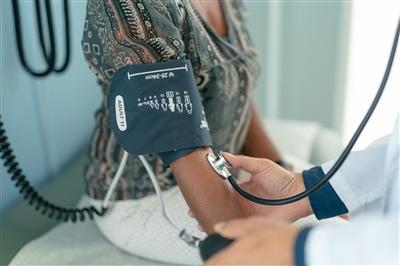 Woman getting blood pressure taken