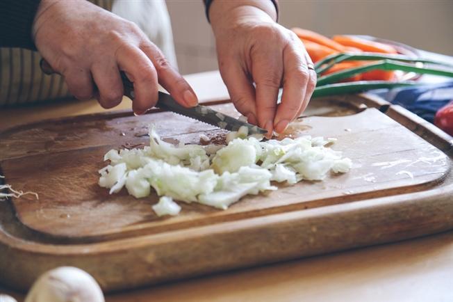 onion being diced on a cutting board onion being diced on a cutting board