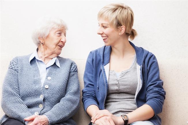 aging woman and her female caregiver