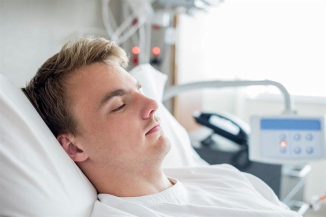 Man sleeping in hospital room Man sleeping in hospital room