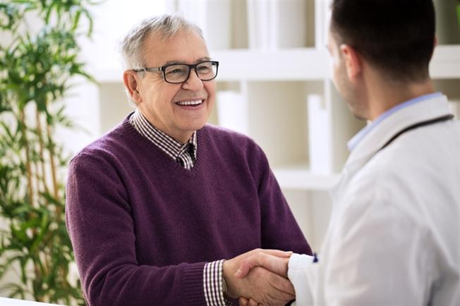 Man meeting with medical professional
