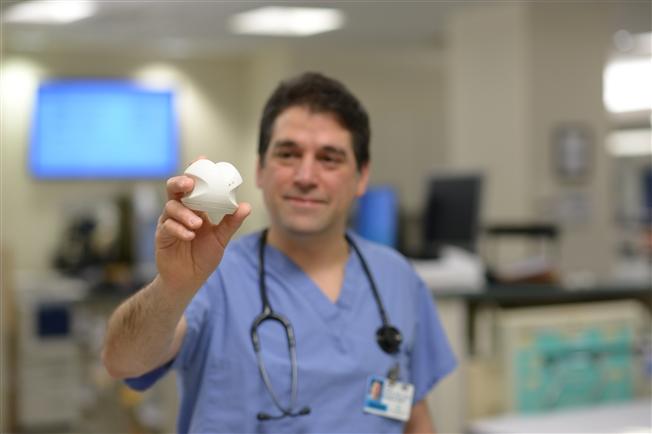Dr. Harris holding tricorder