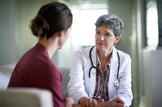 Doctor talking with patient