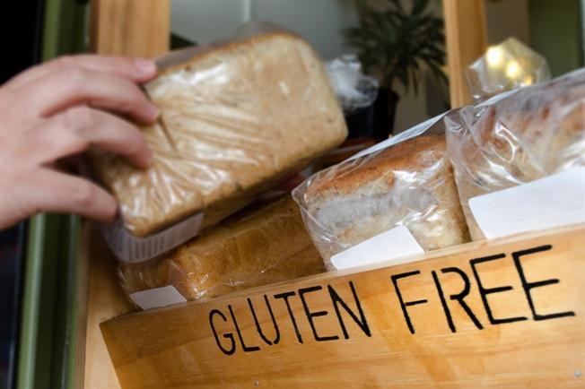 Gluten-free sign and bread shelf