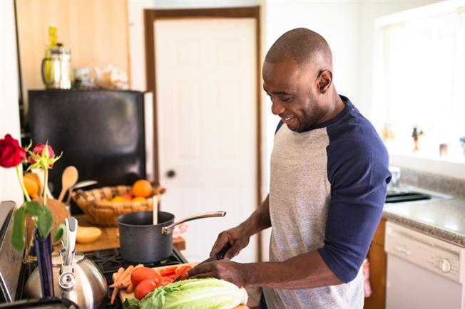 Man cooking with fresh ingredients in the kitchen