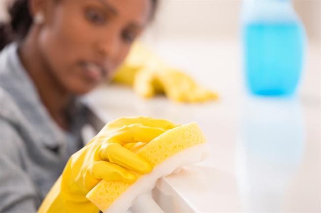 Person cleaning counter