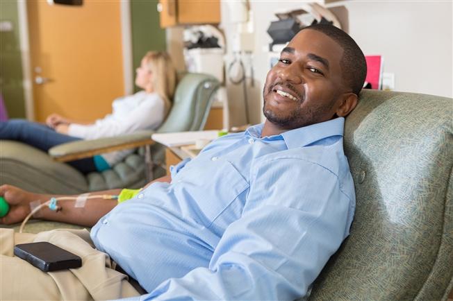 Man giving blood at hospital Man giving blood at hospital