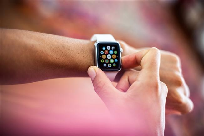 Person using smartwatch Person using smartwatch