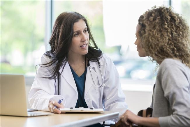 Woman at doctor for medical consultation