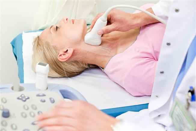 Woman getting carotid artery ultrasound