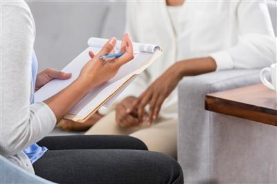 Clinician talking to patient Clinician talking to patient