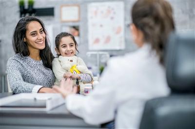 Patient and child talking to clinician