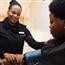 Woman taking patient's blood pressure