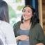 Pregnant woman talking to midwife