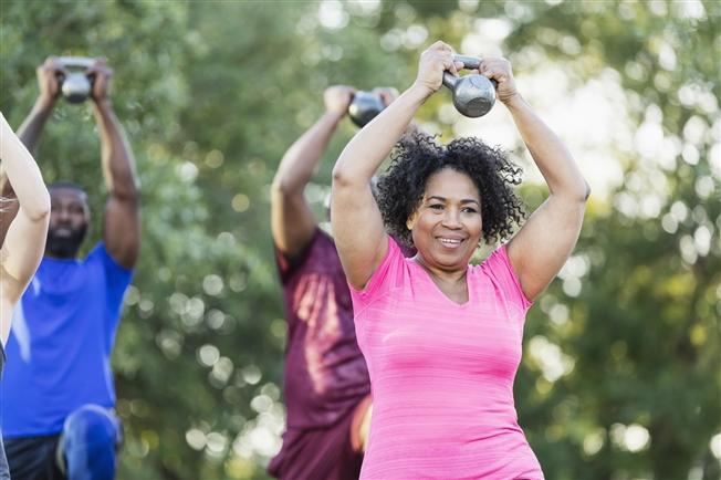 Group of people exercising outside