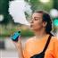 Young adult vaping outside