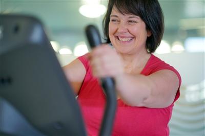Woman exercising on elliptical