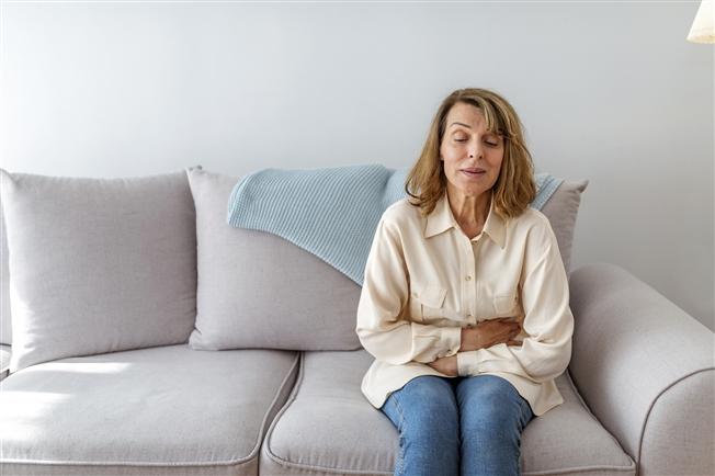 Woman with stomach pain Woman with stomach pain