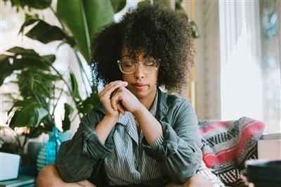 Woman meditating with eyes closed