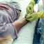 Doctor drawing blood from patient's arm