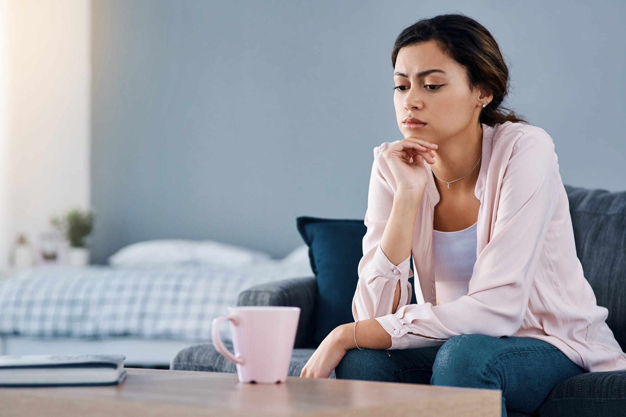 Woman sitting alone and looking stressed