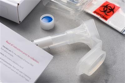 DNA genome saliva collection kit stock photo