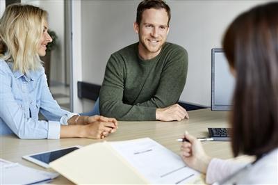 Young couple having discussion with doctor