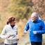Mature older couple exercising outside together