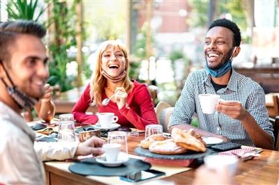 Young group of friends having fun together at local restaurant Young group of friends having fun together at local restaurant