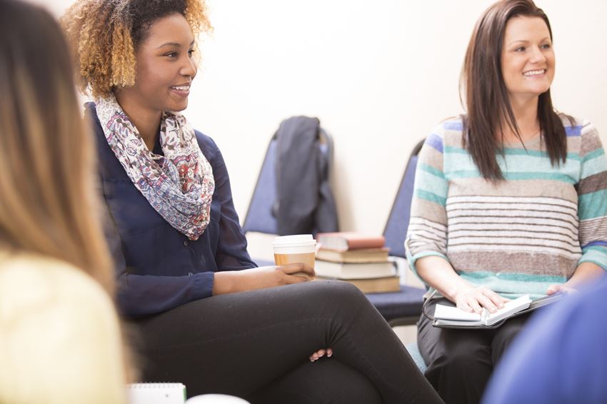 Group of women sitting together during therapy session