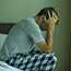 Man sitting on bed