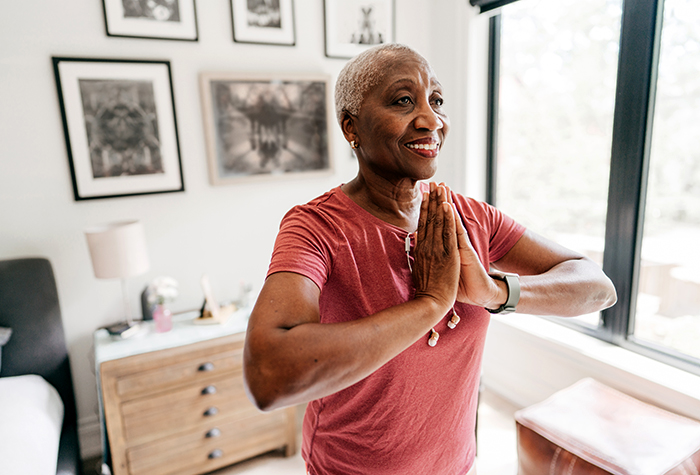 Senior woman exercising at home