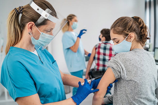 students getting vaccinated at vaccine clinic