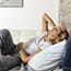 Woman lying on couch