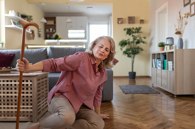 woman pulling herself up after falling