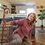 woman pulling herself up after falling