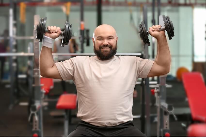 Man lifting weights in gym