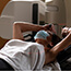 woman preparing to receive radiation treatment