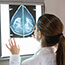 Clinician reviews mammogram film